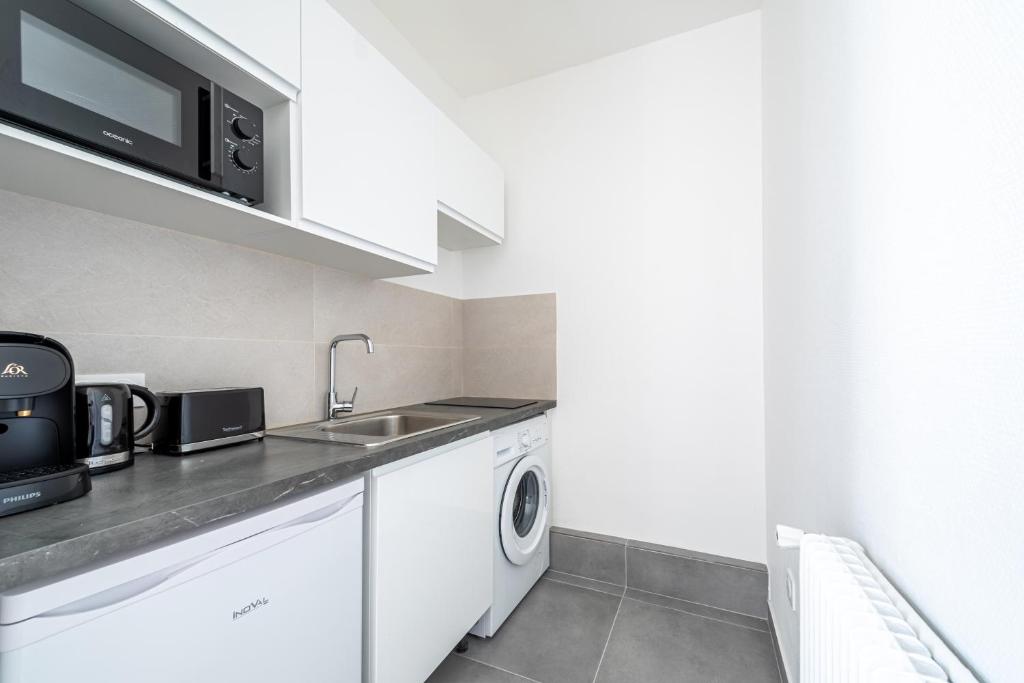 Kuchyň nebo kuchyňský kout v ubytování Studio paisible proche Paris 16ème arr - III