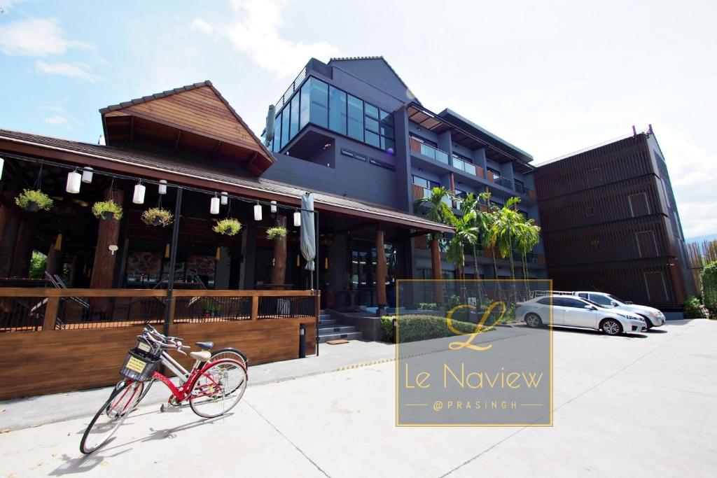 a bike parked in front of a building at Le Naview @Prasingh in Chiang Mai