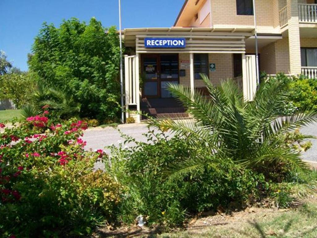 a building with a sign that reads riccarton at Ocean View Villas in Geraldton