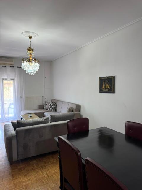 a living room with a couch and a table at Almeta Apartment 3 in Chios