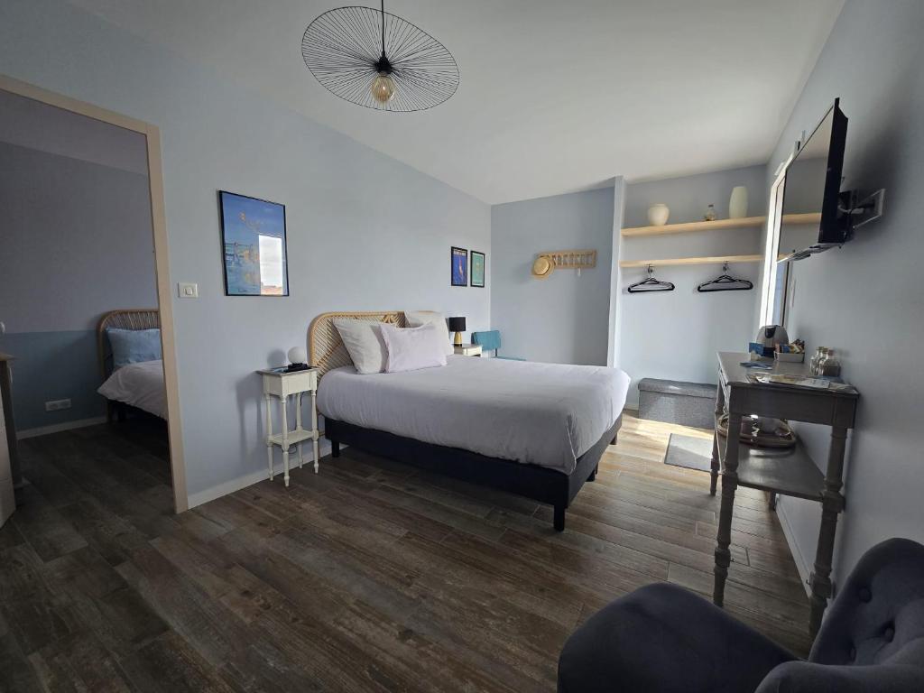 En eller flere senge i et værelse på Chambres D'hôtes Authentique Pornic