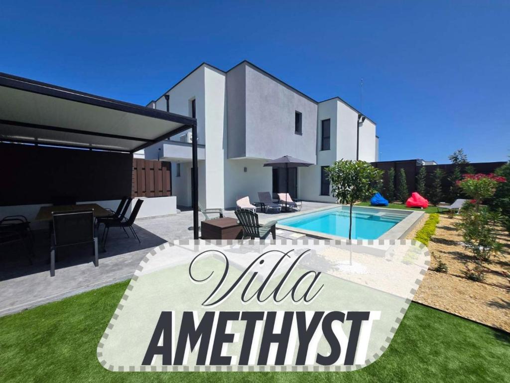 a villa with a swimming pool and a house at villa Amethyst in Lozenets