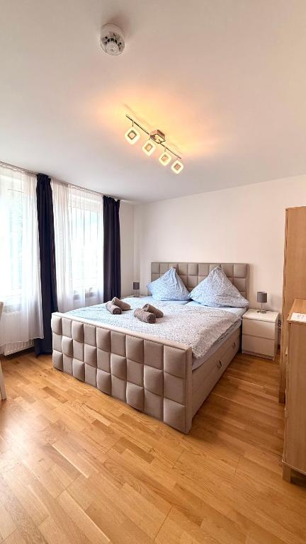 a bedroom with a large bed in a room at Media harbor domicile in Düsseldorf