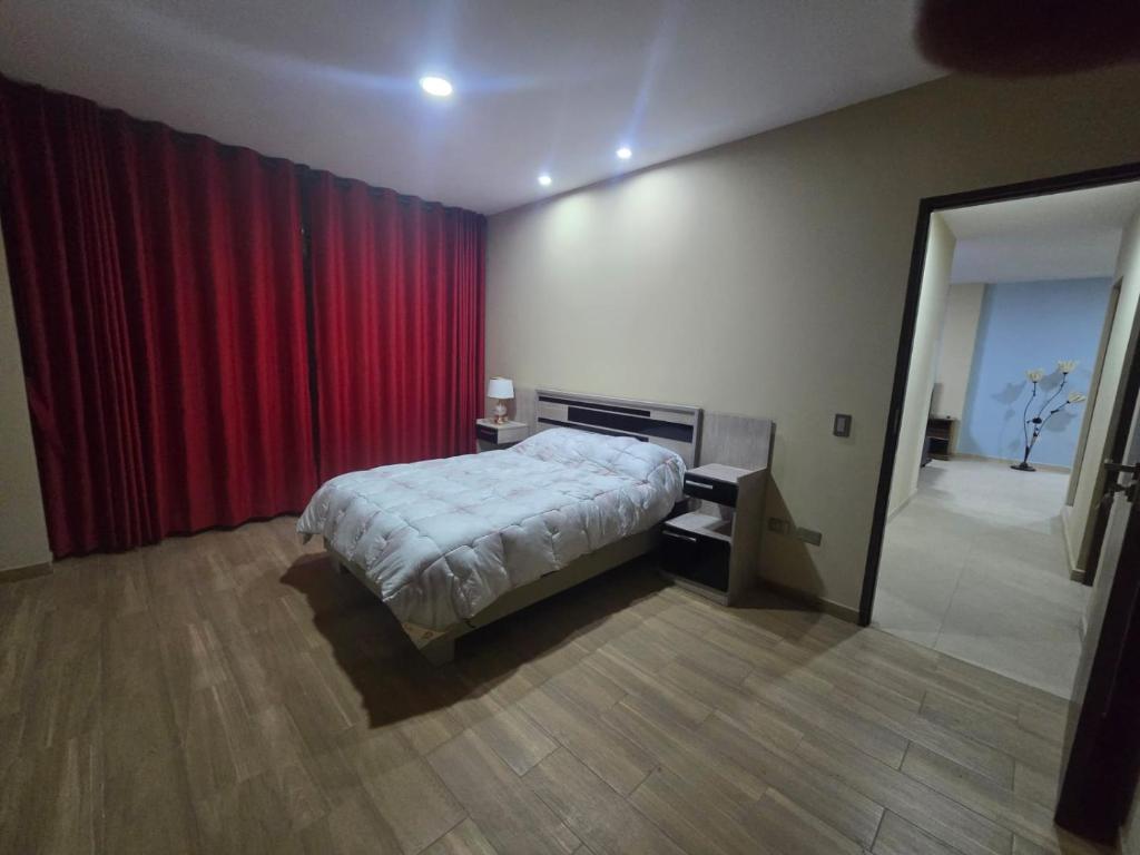 Llit o llits en una habitació de Quirpinchaca Premier