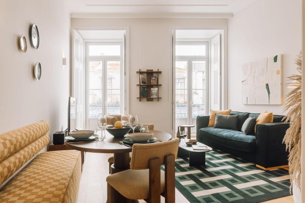 a living room with a couch and a table at Ando Living - Abrantes 50 House in Lisbon