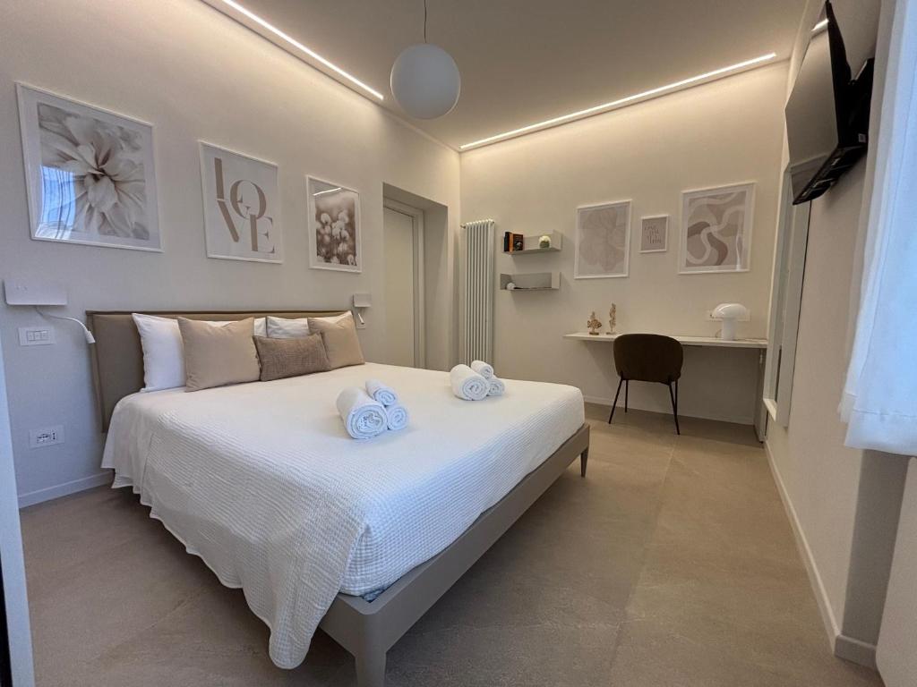 a bedroom with a bed with two towels on it at Il Torretto in La Spezia