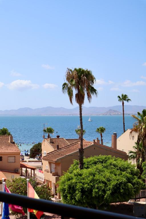 a view of the ocean from a balcony at Apartahotel Punta Calera in Los Alcázares