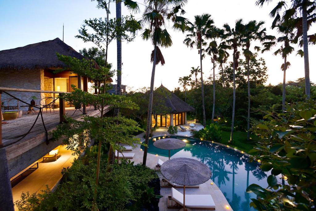 an aerial view of a resort with a swimming pool at Planta Boutique Resort in Canggu