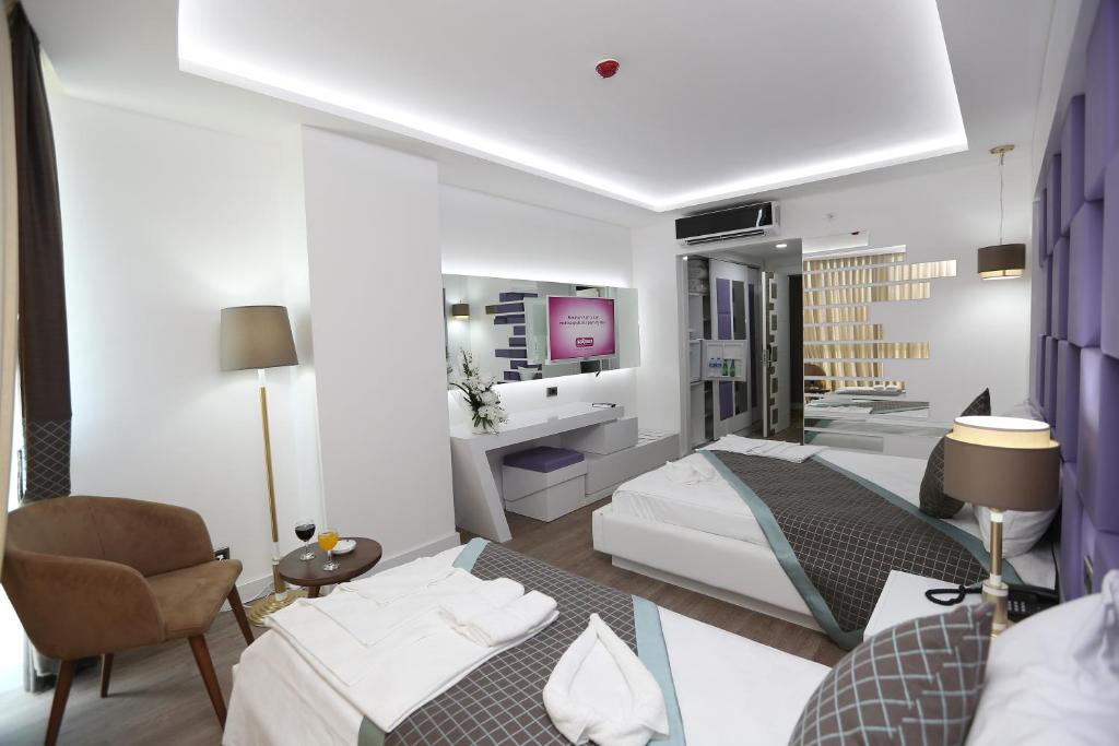 Postel nebo postele na pokoji v ubytování Elips Royal Hotel & SPA