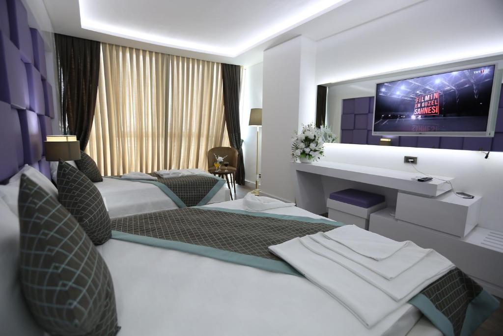 Postel nebo postele na pokoji v ubytování Elips Royal Hotel & SPA