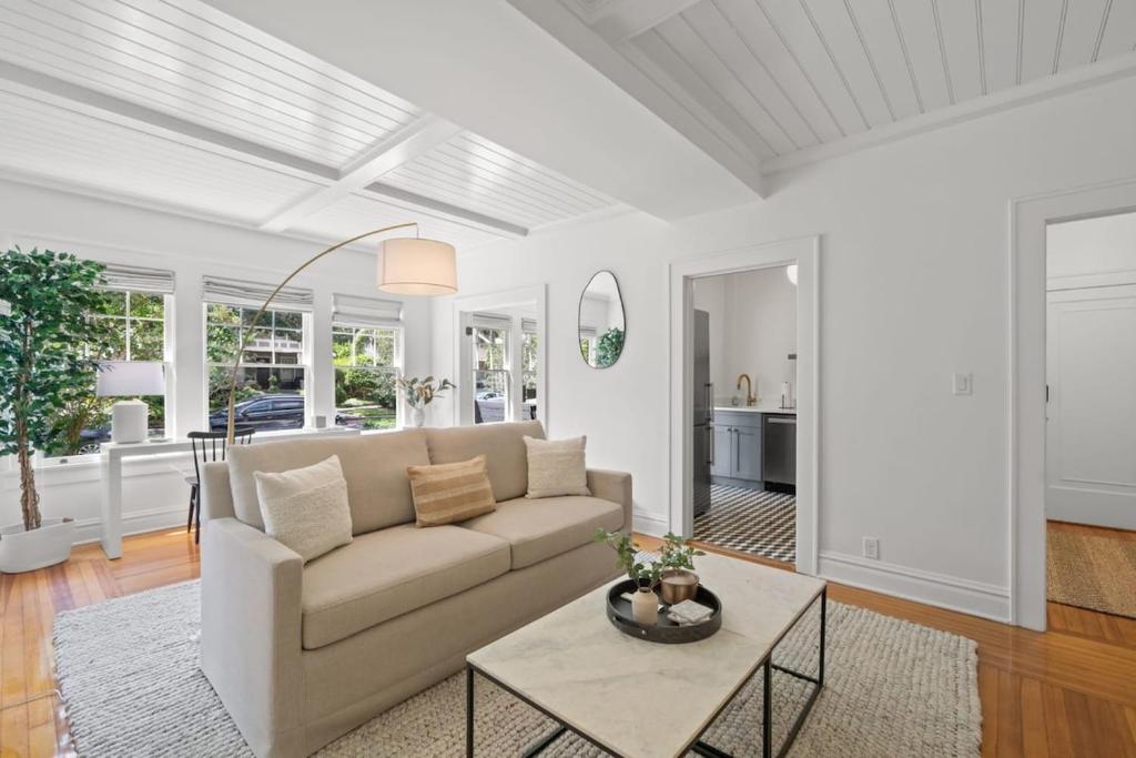 a living room with a couch and a table at The Adaline Room #5 - Upscale Hyde Park Apartment, 1st Floor, Steps to Bayshore in Tampa
