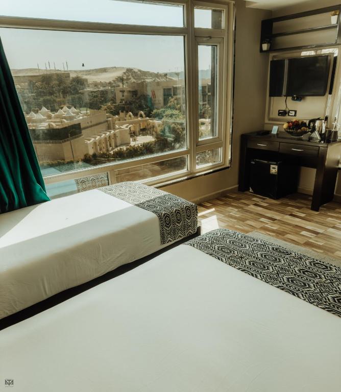 Turquoise Pyramids & Grand Egyptian museum view Hotel - 13
