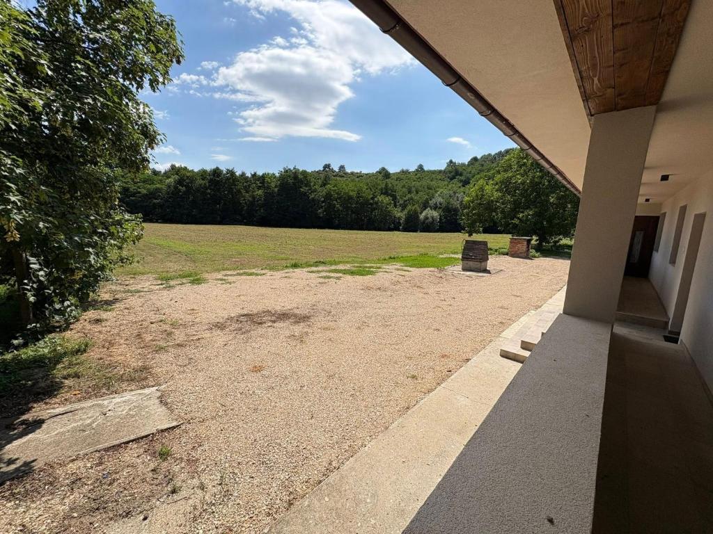 a view of a field from the porch of a house at Csenkő Vendégház in Zsujta