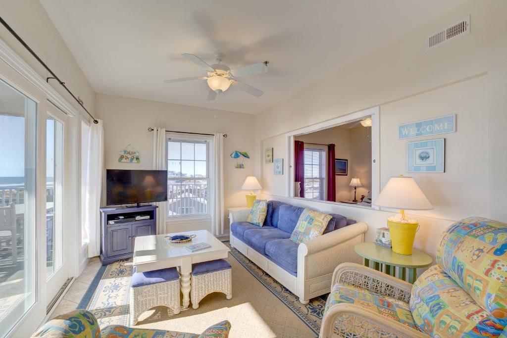 a living room with a couch and a tv at Shores Fine Again 836 #211DS-H in Hatteras