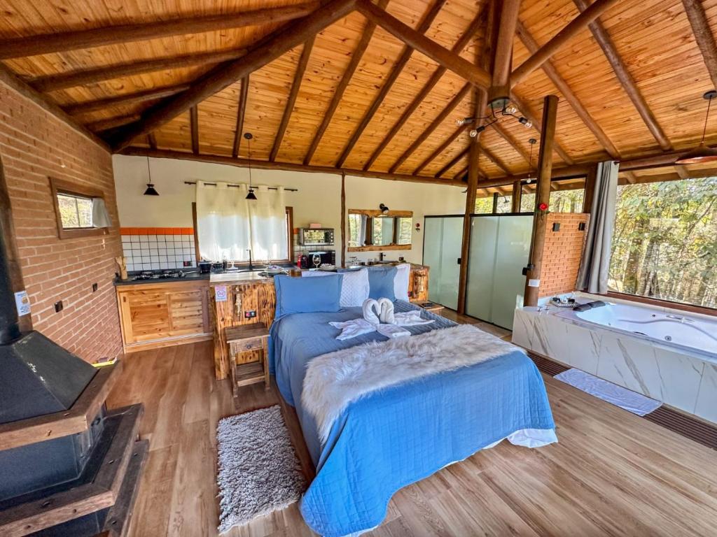 Postel nebo postele na pokoji v ubytování Chalé Valle dos sonhos