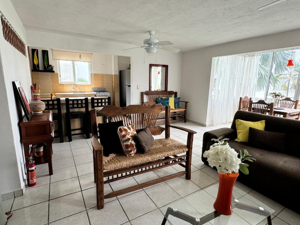 a living room with a couch and a table at Condominios la marina in Puerto Vallarta