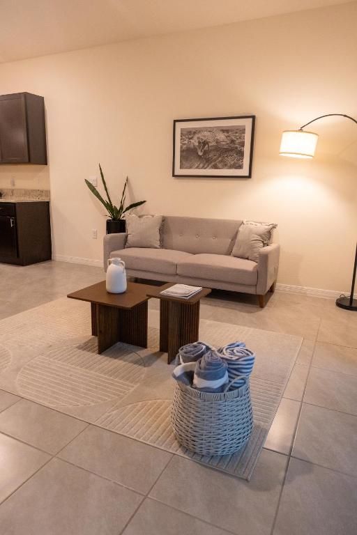 a living room with a couch and a table at South Shore Suites in Wimauma