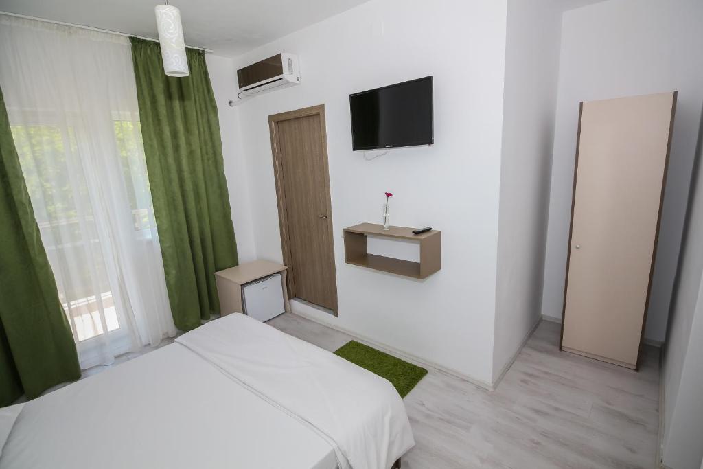 TV a/nebo společenská místnost v ubytování Hotel Atlantis