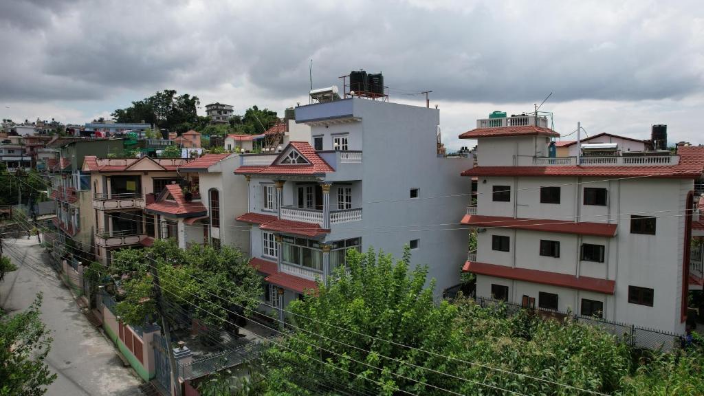 a group of buildings in a city at Below The Hills suite WHome Theatre in Kathmandu