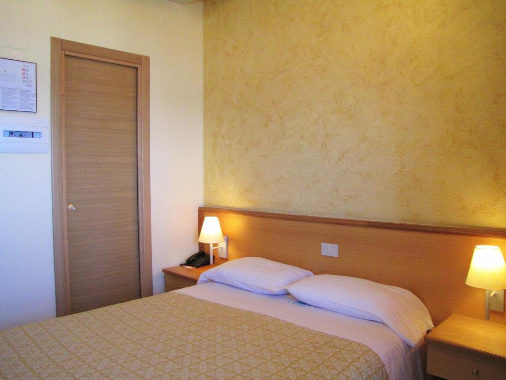 Postel nebo postele na pokoji v ubytování Hotel La Tonnara