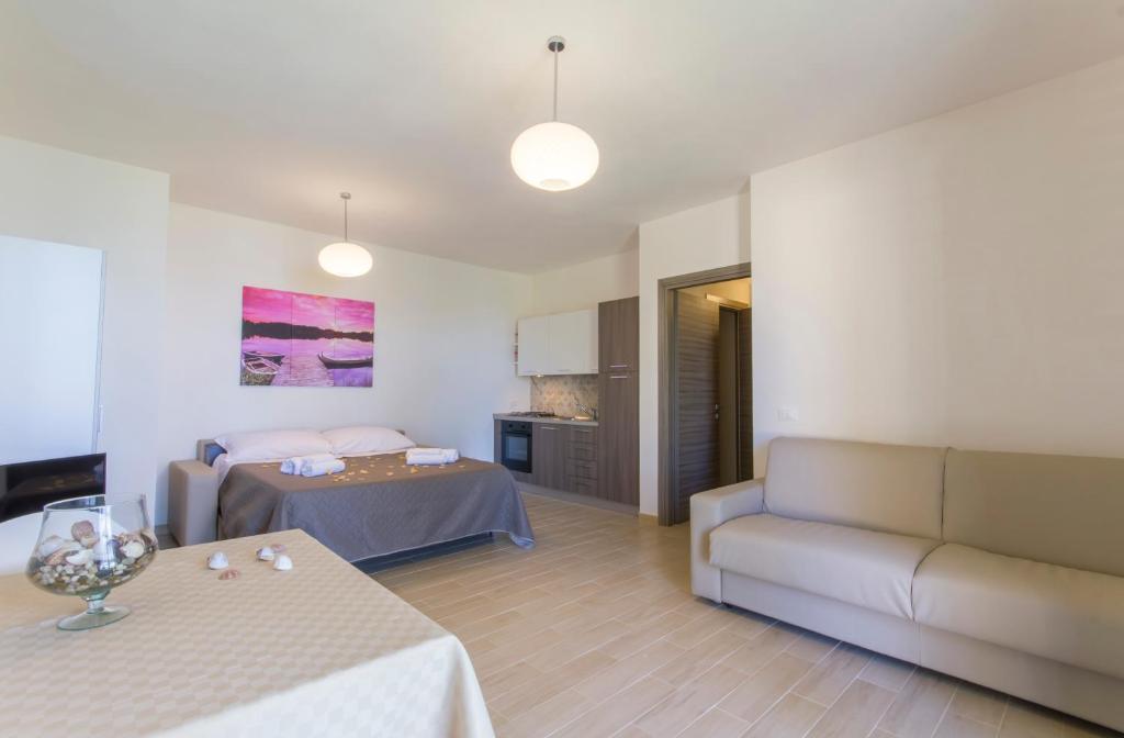 A bed or beds in a room at La Perla dello Stagnone