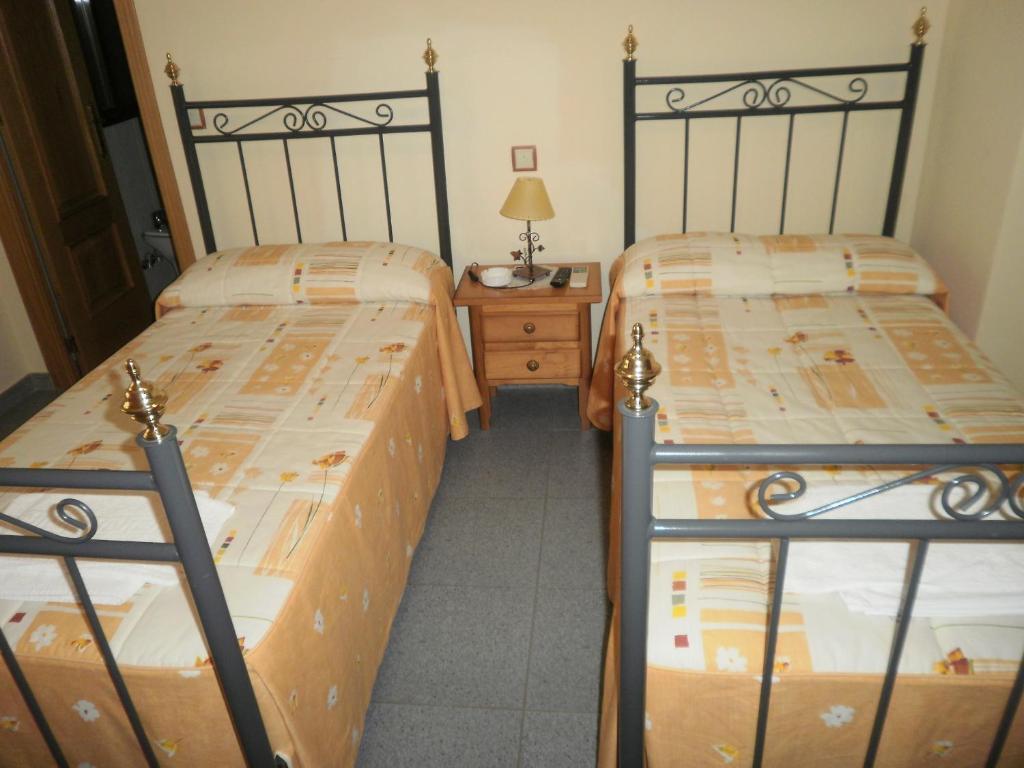 Postel nebo postele na pokoji v ubytování Hostal Miraflor de las Cadenas