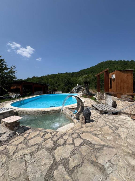 a swimming pool with a water slide in the middle at Villa Aresini in Montemiletto
