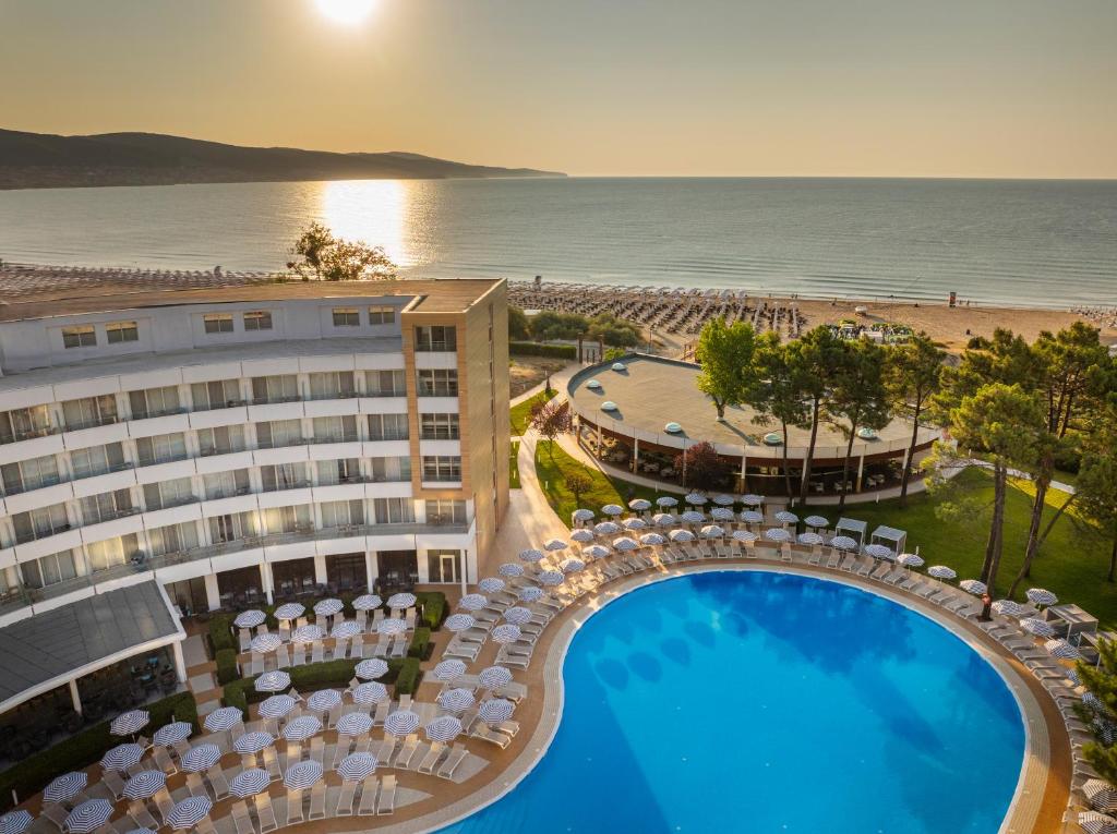 an aerial view of a hotel with a pool and the ocean at AluaSoul Sunny Beach - Adults Only - All Inclusive in Sunny Beach