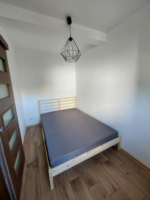 Postel nebo postele na pokoji v ubytování Sunny Family Zator Energylandia