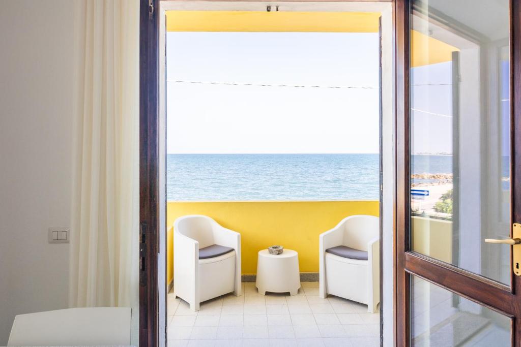 a room with a view of the ocean at Villa Fausta in La Maddalena