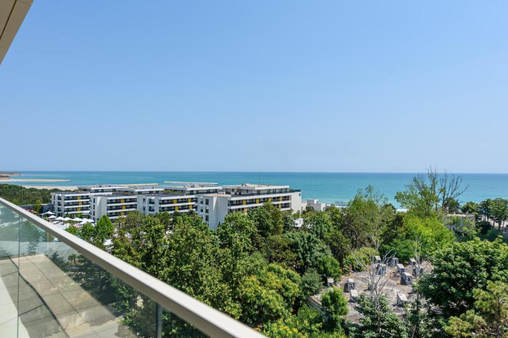 a view of the ocean from the balcony of a building at Relax Blue VOGH in Olimp