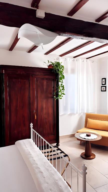 a room with a bed and a couch and a table at Casa Due Marie Boutique stay near Bologna and Modena in Marano sul Panaro