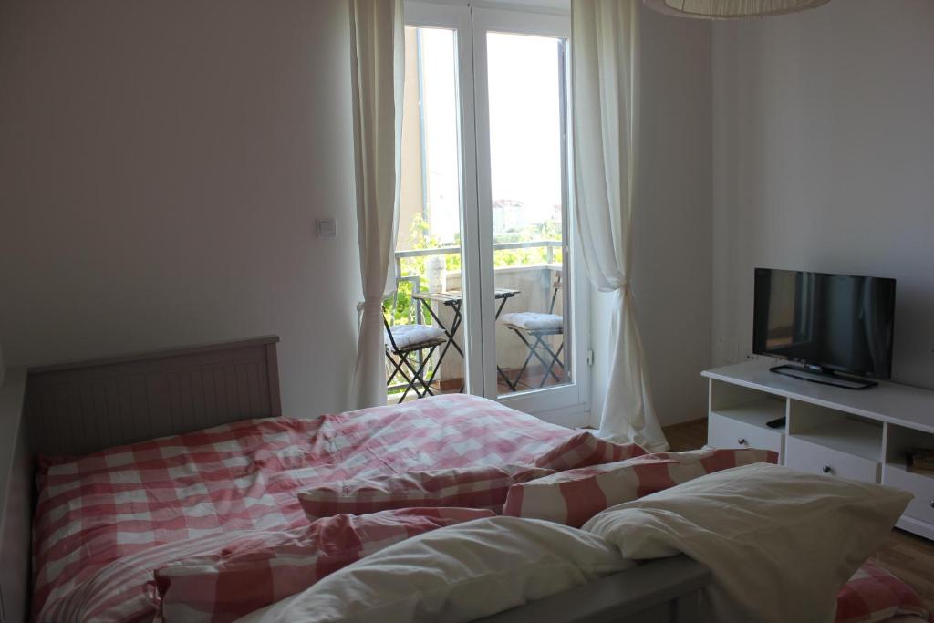 Posteľ alebo postele v izbe v ubytovaní Smile & Enjoy Apartments