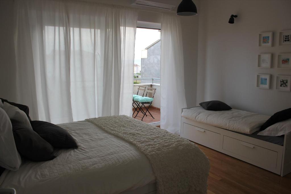 Posteľ alebo postele v izbe v ubytovaní Smile & Enjoy Apartments