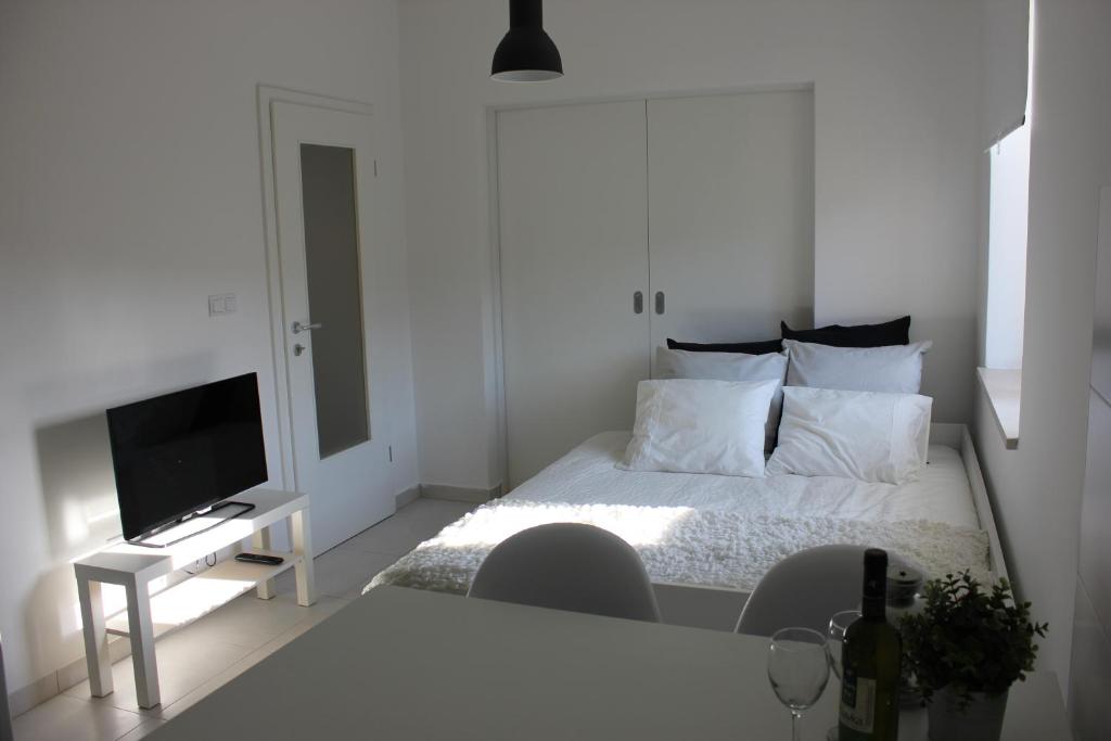 Posteľ alebo postele v izbe v ubytovaní Smile & Enjoy Apartments
