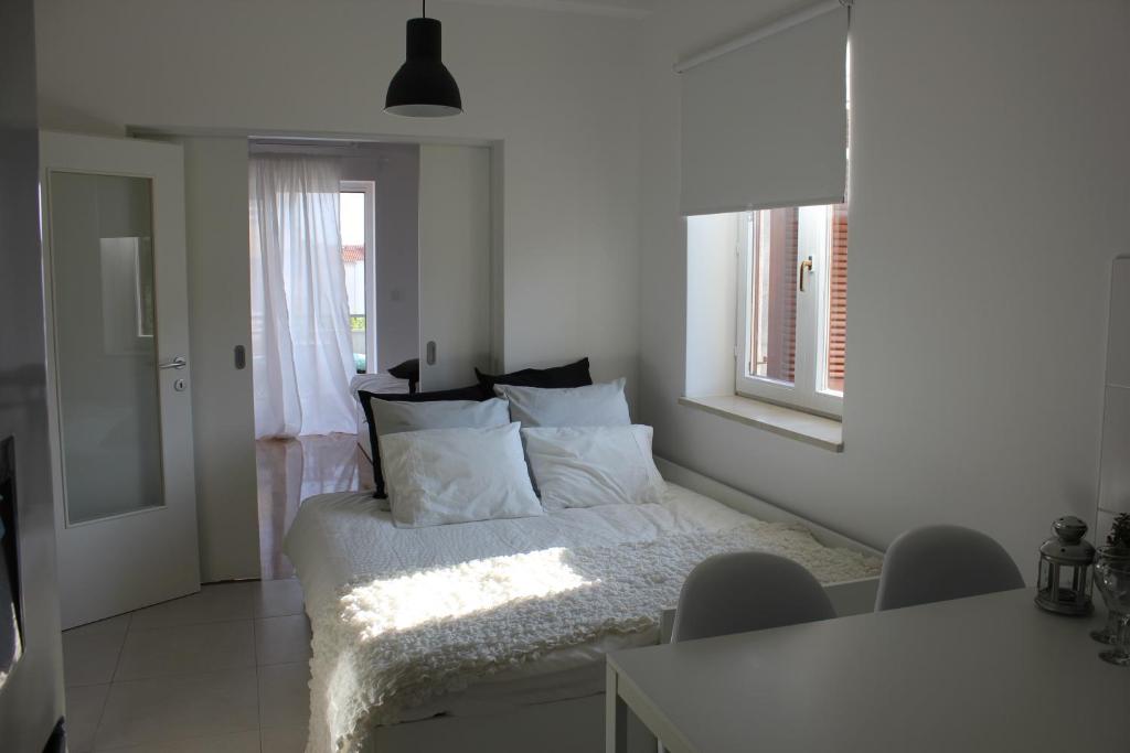 Posteľ alebo postele v izbe v ubytovaní Smile & Enjoy Apartments