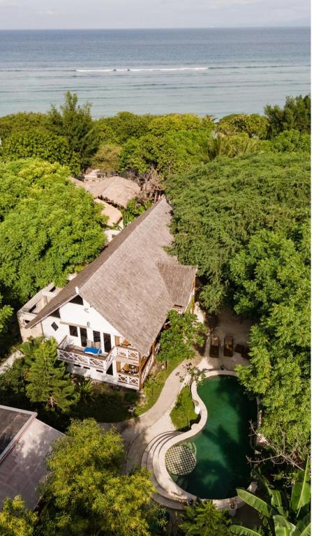 an aerial view of a house in the woods at Serene Beach Villa in Gili Trawangan