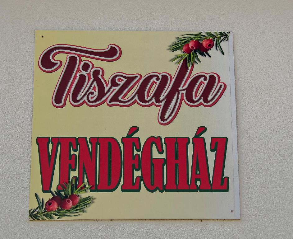 a sign for a vanderbilt dealership on a wall at Tiszafa Vendégház Nagykanizsa in Nagykanizsa