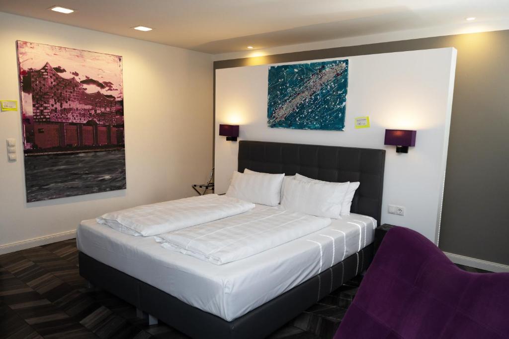 Ένα ή περισσότερα κρεβάτια σε δωμάτιο στο Hotel52 Bergheim