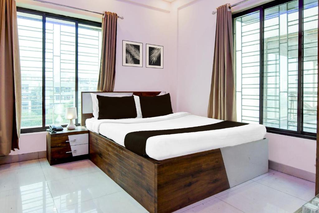 Ένα ή περισσότερα κρεβάτια σε δωμάτιο στο Hotel O Himgiri Guest House