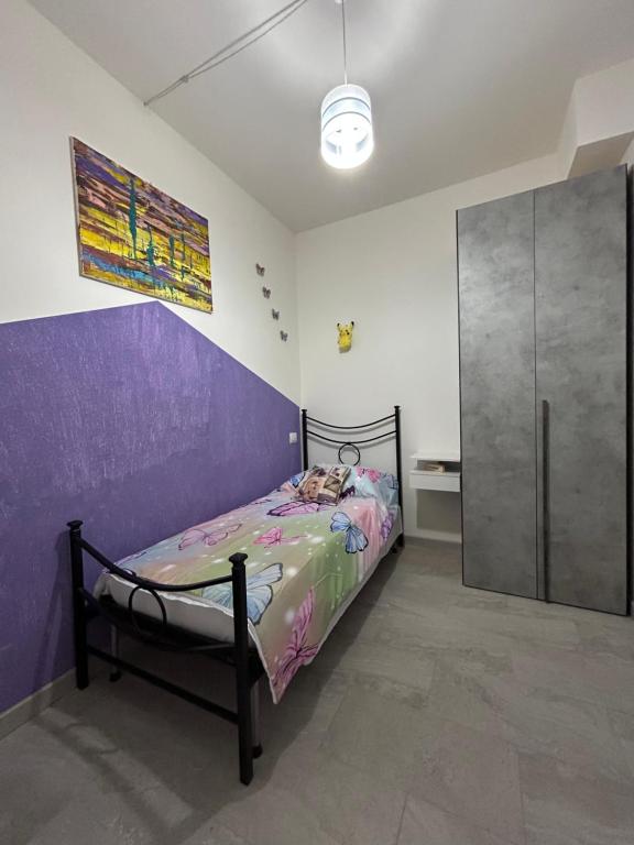 Кровать или кровати в номере Il Paradiso Delle farfalle