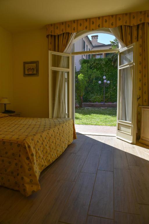 Postel nebo postele na pokoji v ubytování Hotel Sant'Andrea