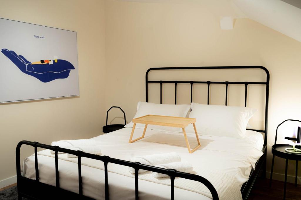 Ένα ή περισσότερα κρεβάτια σε δωμάτιο στο Stayna Apartments