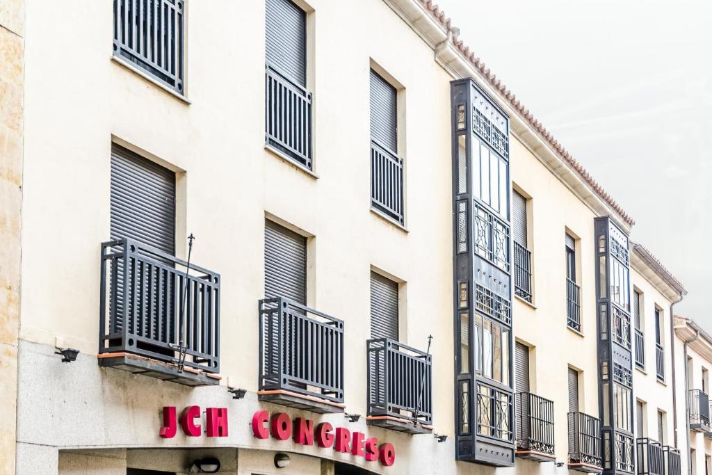 a building with balconies on the side of it at JCH Congreso Apartamentos in Salamanca