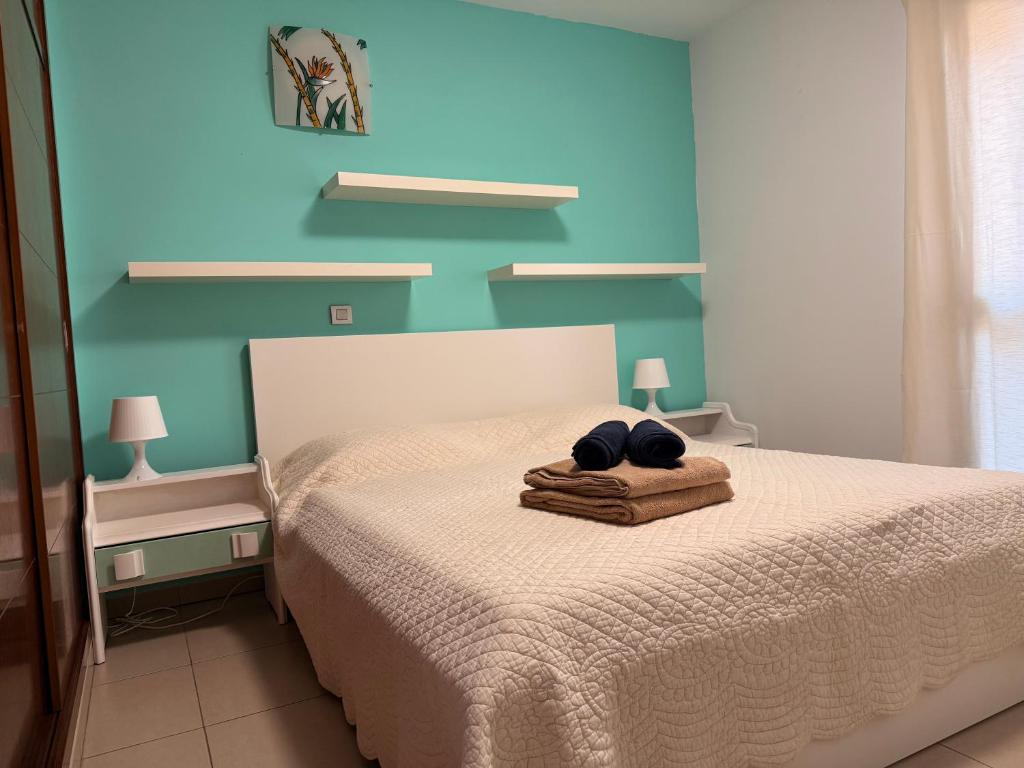 En eller flere senge i et værelse på Cali