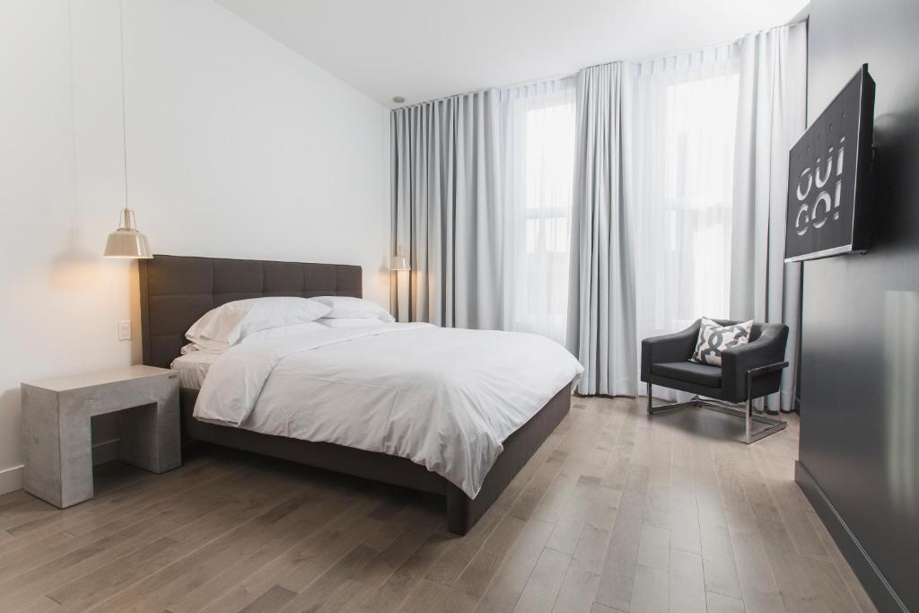 Postel nebo postele na pokoji v ubytování Hotel Oui GO!