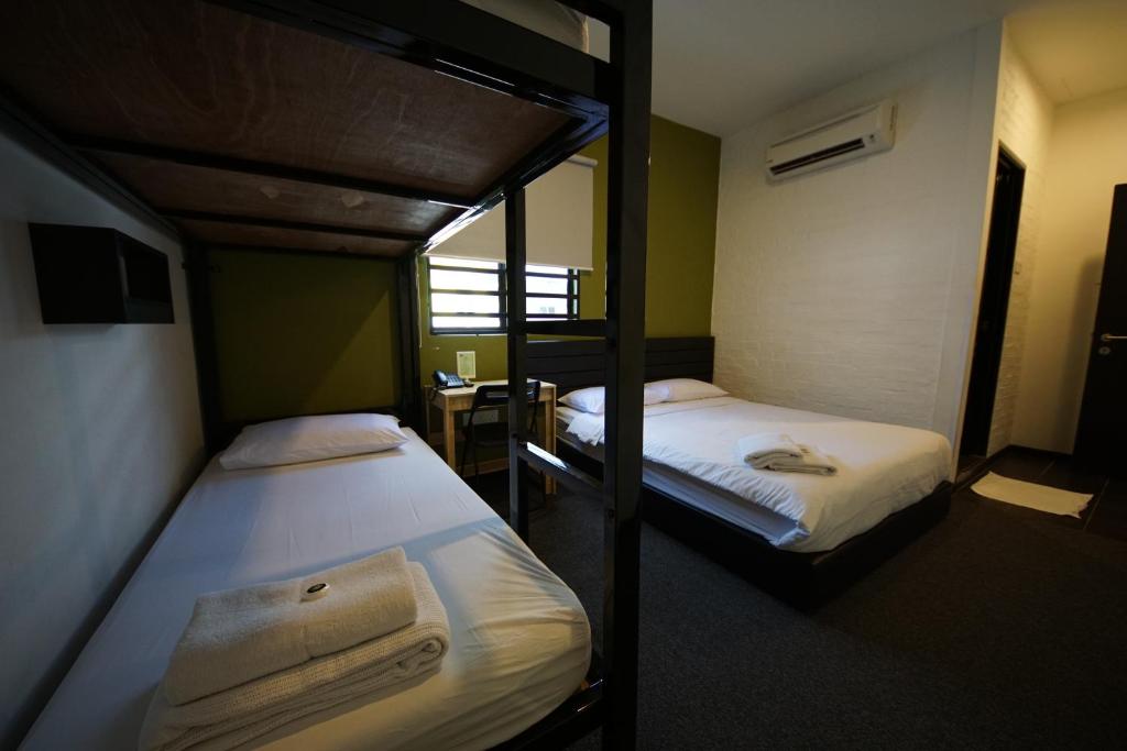 Postel nebo postele na pokoji v ubytování Tulip Hotel