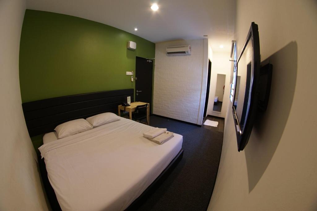 Postel nebo postele na pokoji v ubytování Tulip Hotel