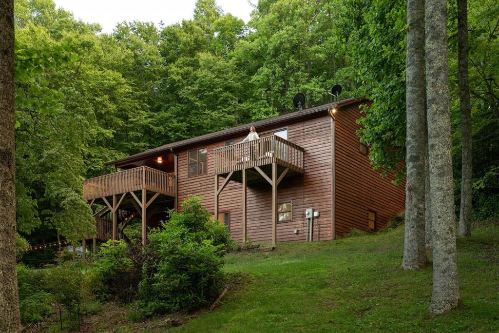 a cabin in the woods with two decks at Perfect Luxe Retreat with Hot Tub in Gerton
