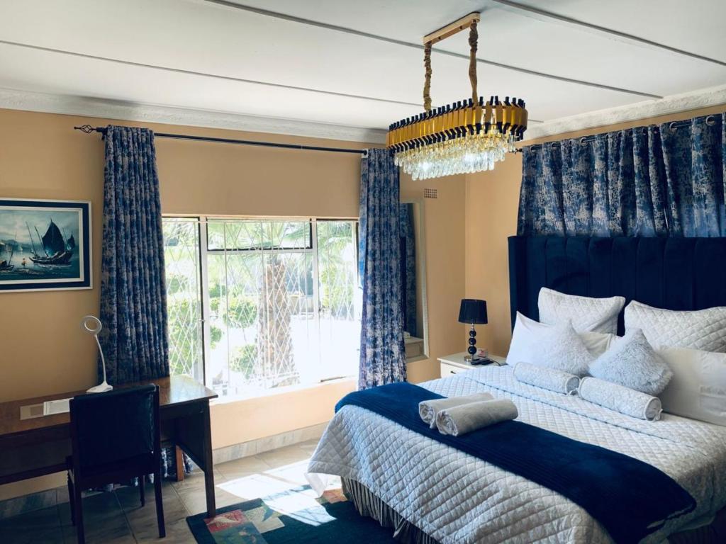 Postel nebo postele na pokoji v ubytování uPhondo Lodge